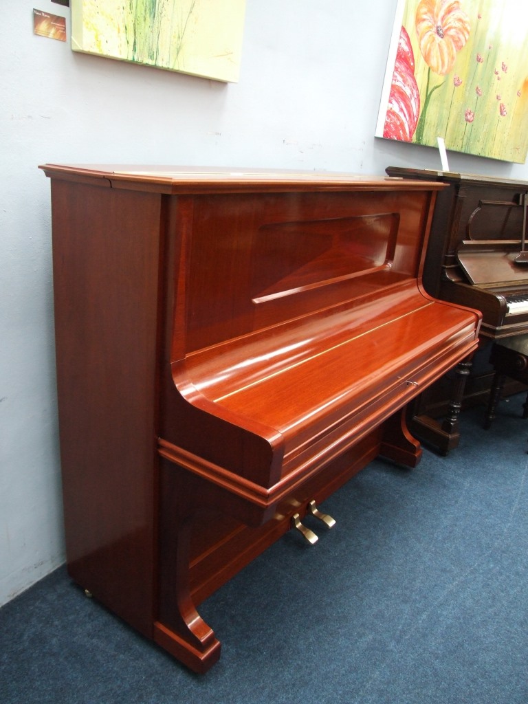 Grotrian Steinweg upright piano in mahogany lid closed.